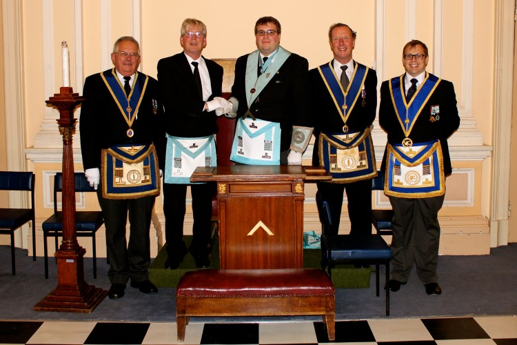 The WM and members of the Lodge congratulating W.Bro. Toby Baxter of Beneficentia Lodge, No.5308 on his Installation.