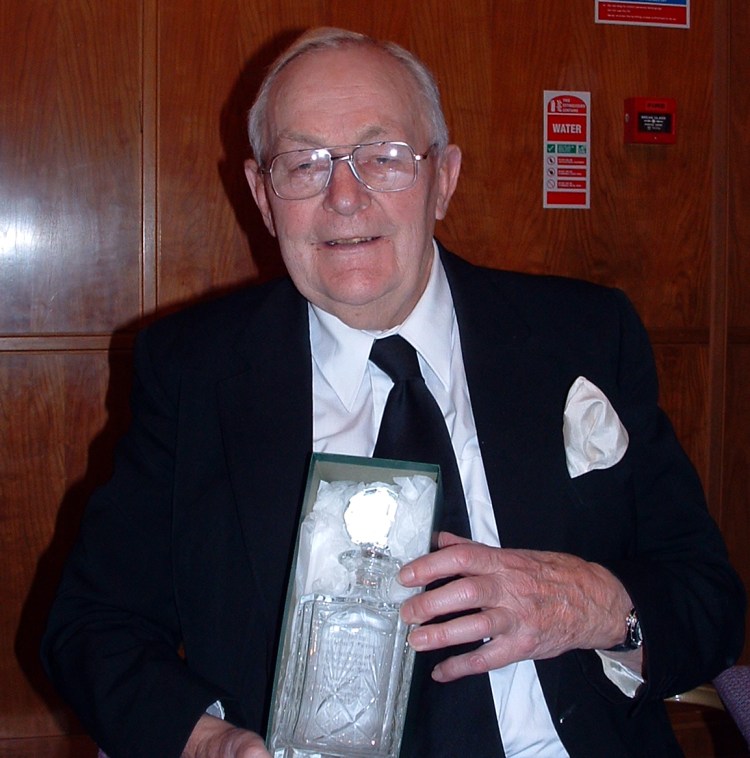 W.Bro. John Farmer receving a goblet presented by the Brethren of the Wyggeston Lodge No.3448 to mark his 50 years in Freemasonry in 2003